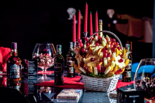Celebrating Happy New Year with Edible Fruit Arrangements as a centerpiece on the table.